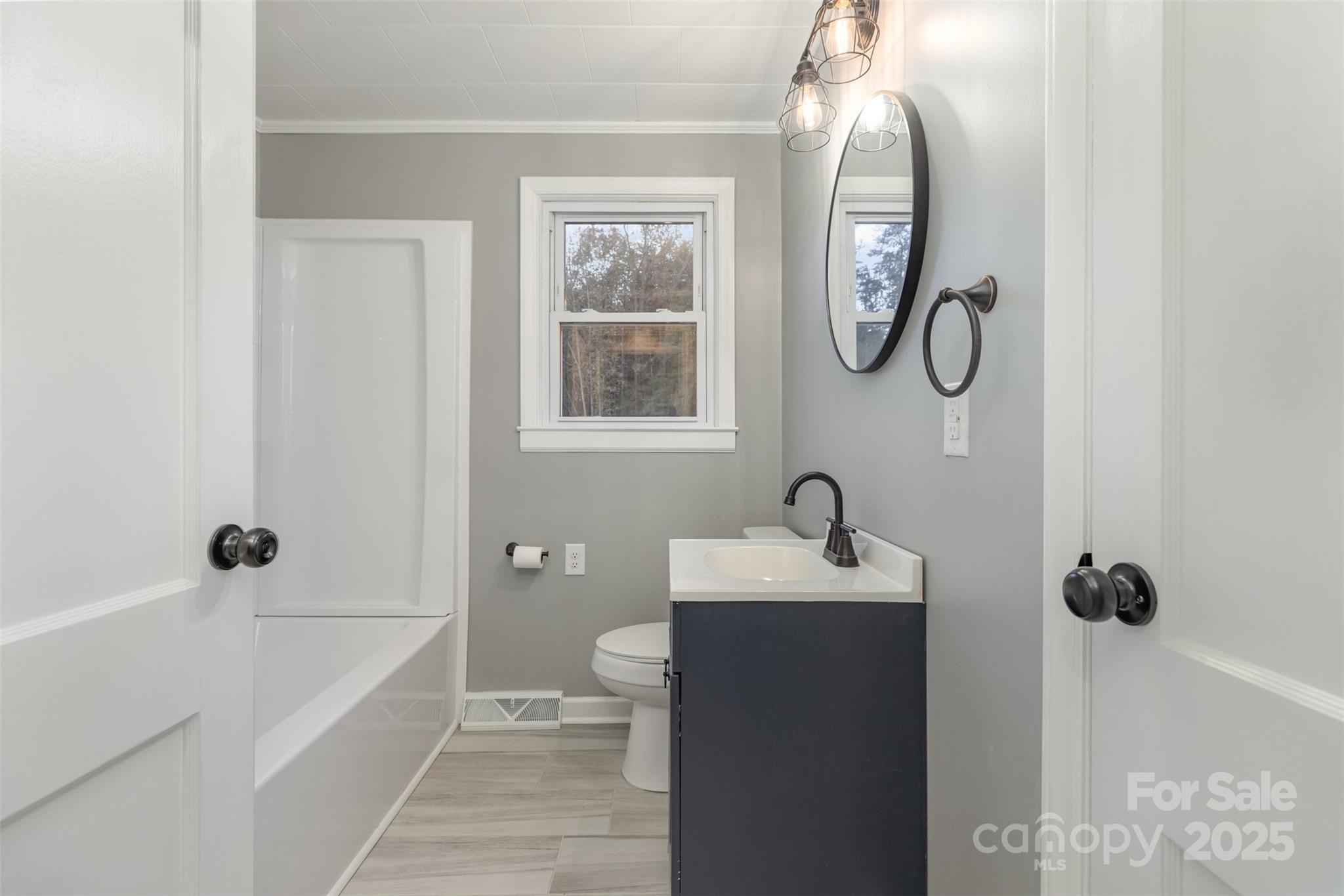 273 Stanley Spencer Mountain Road Gastonia, NC 28056 - Photo 14 of 17 a bathroom with a sink a toilet and shower