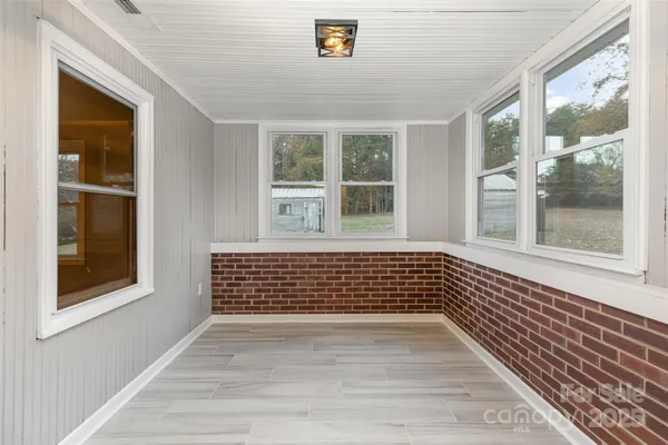 a view of empty room with windows