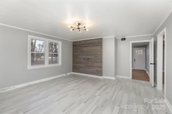 a view of an empty room with a window