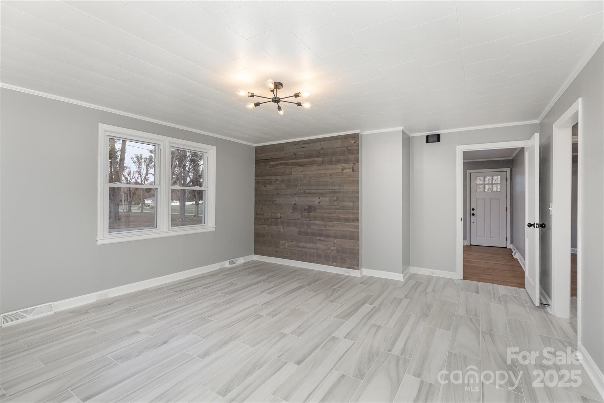 273 Stanley Spencer Mountain Road Gastonia, NC 28056 - Photo 5 of 17 a view of an empty room with a window