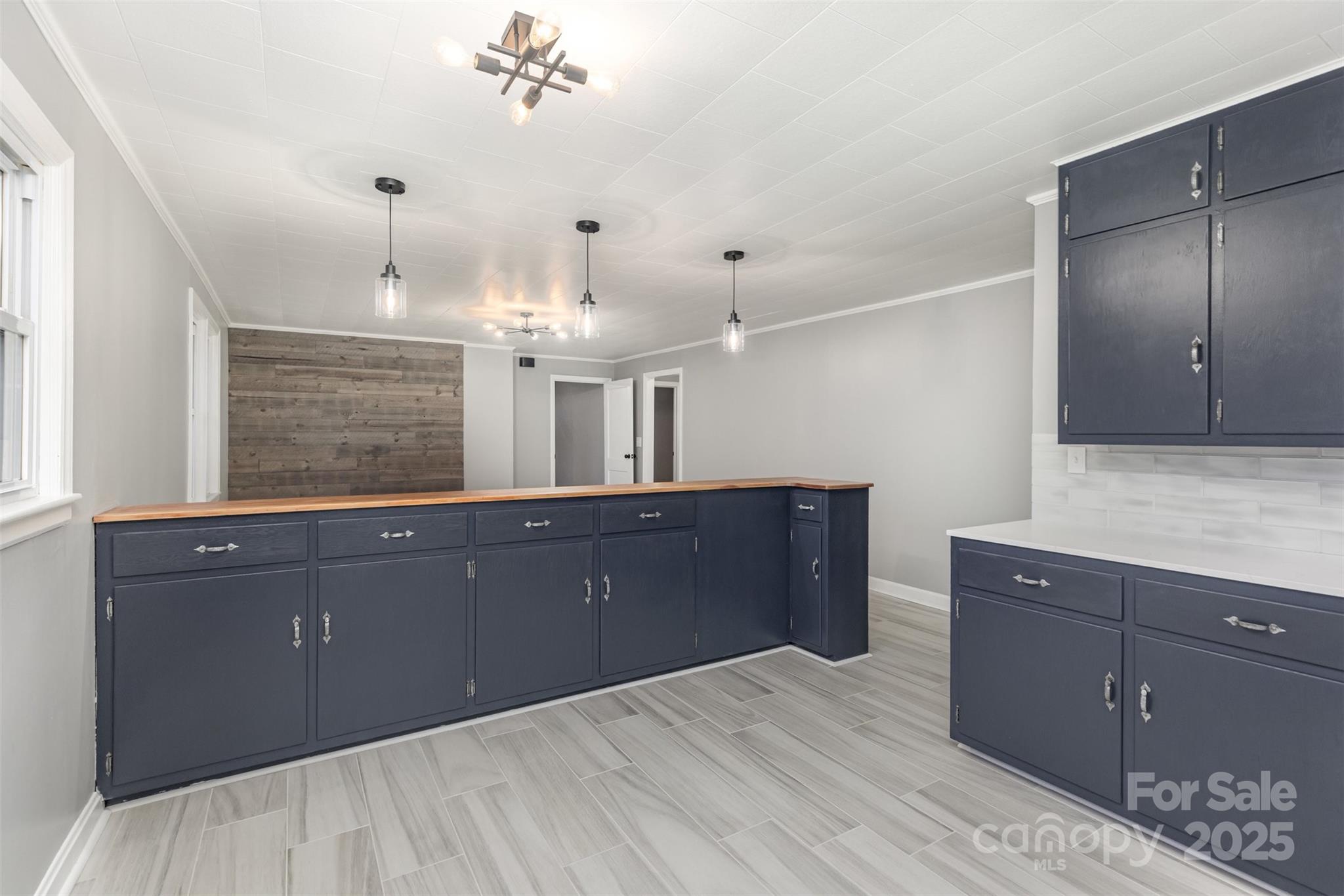 273 Stanley Spencer Mountain Road Gastonia, NC 28056 - Photo 9 of 17 a kitchen with granite countertop a sink and cabinets