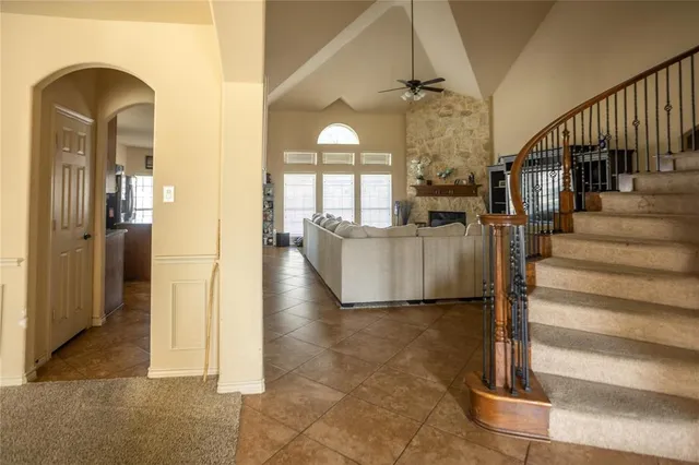 a view of a hallway with entryway wooden floor and dining room view