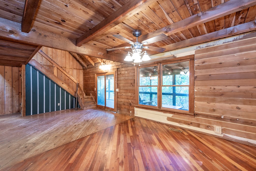 168 Burnt Mountain Cove Road Jasper, GA 30143 - Photo 12 of 53 a view of a room with wooden floor and windows