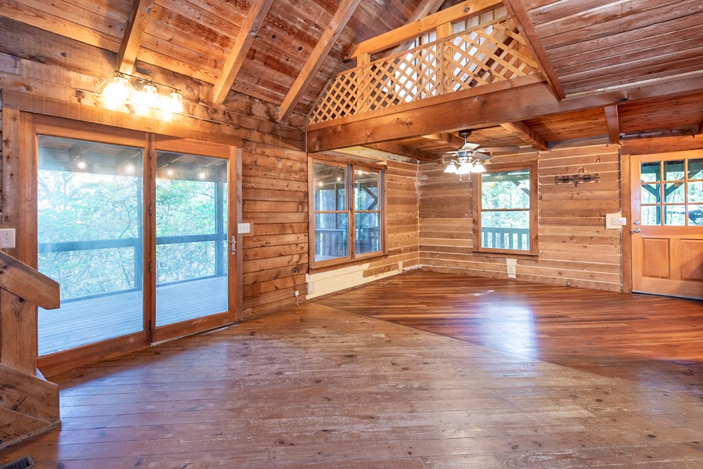 168 Burnt Mountain Cove Road Jasper, GA 30143 - Photo 15 of 53 a view of a room with wooden floors