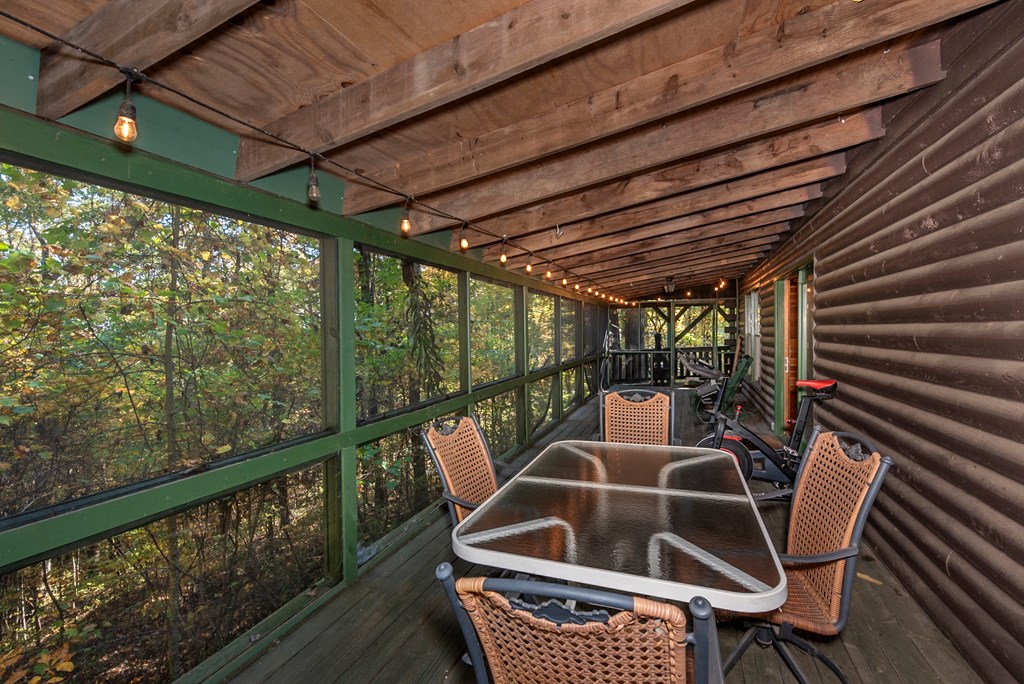168 Burnt Mountain Cove Road Jasper, GA 30143 - Photo 16 of 53 a view of a chairs and table in the roof deck