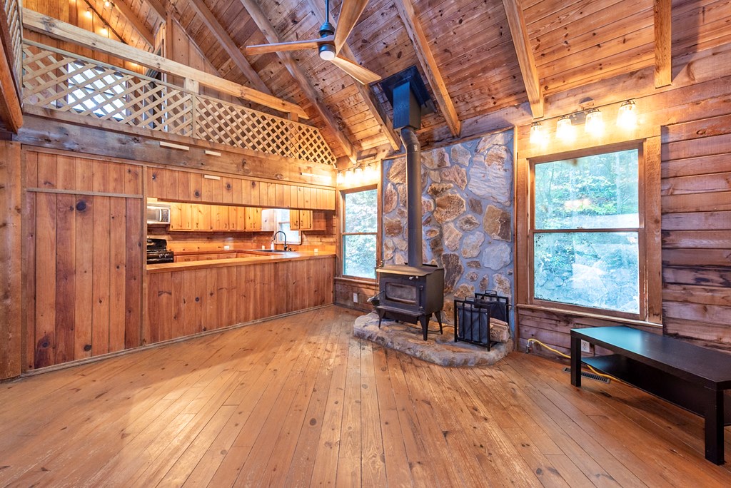168 Burnt Mountain Cove Road Jasper, GA 30143 - Photo 20 of 53 a room with wooden floor and furniture