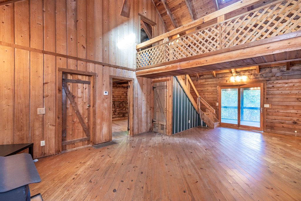 168 Burnt Mountain Cove Road Jasper, GA 30143 - Photo 23 of 53 wooden floor in an empty room