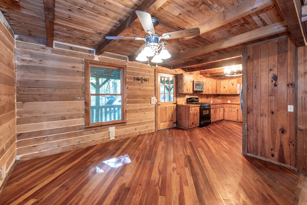 168 Burnt Mountain Cove Road Jasper, GA 30143 - Photo 7 of 53 a view of a room with wooden floor