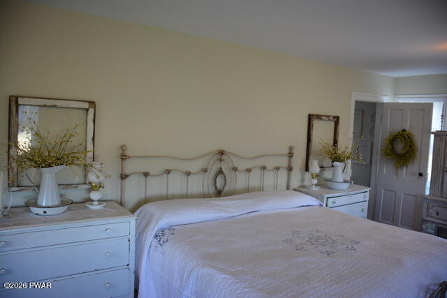 127 Valleyview Road Greentown, PA 18426 - Photo 11 of 66 a bedroom with a bed and a mirror
