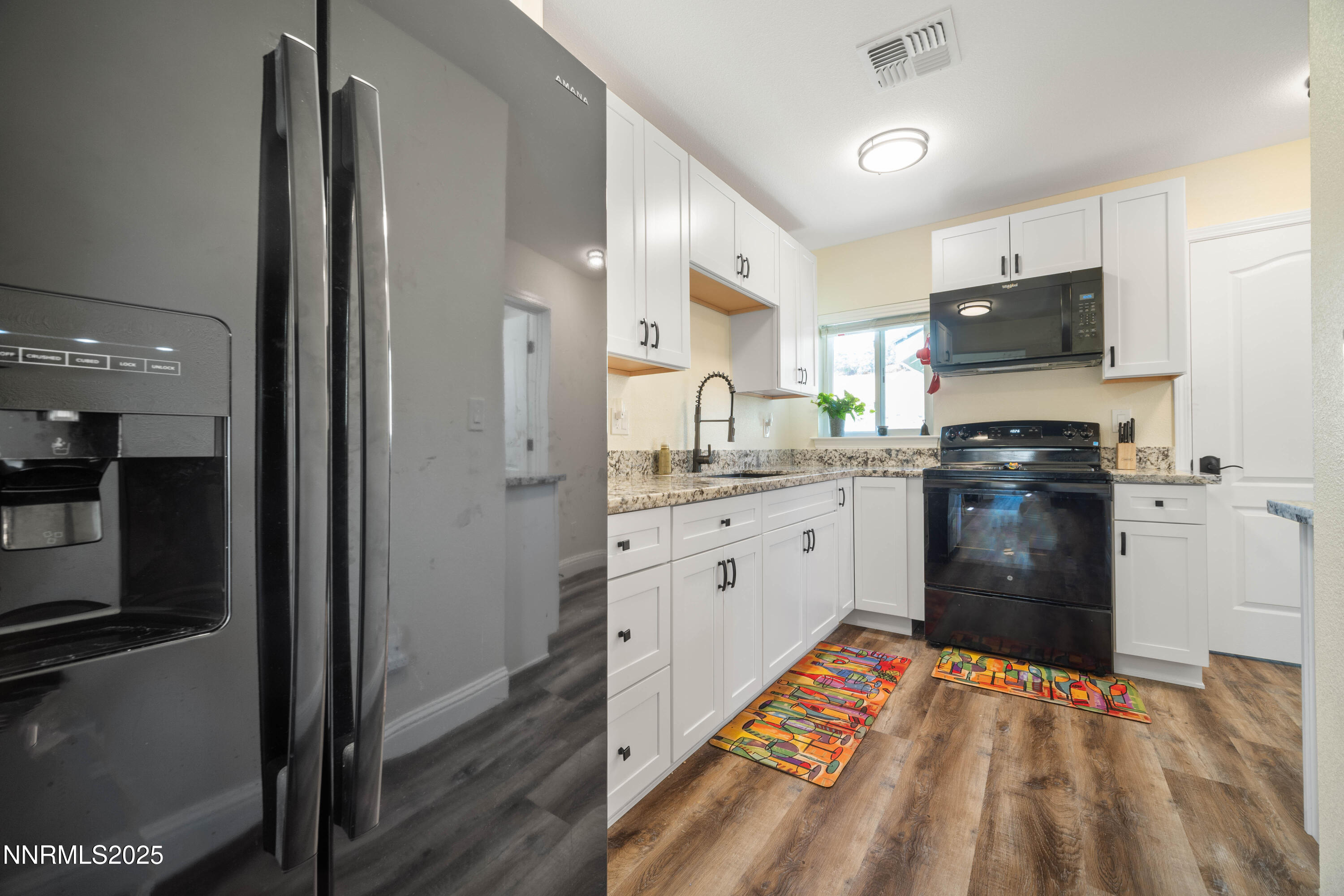 425 Main Street Silver City, NV 89428 - Photo 12 of 27 a kitchen with stainless steel appliances a refrigerator sink and cabinets