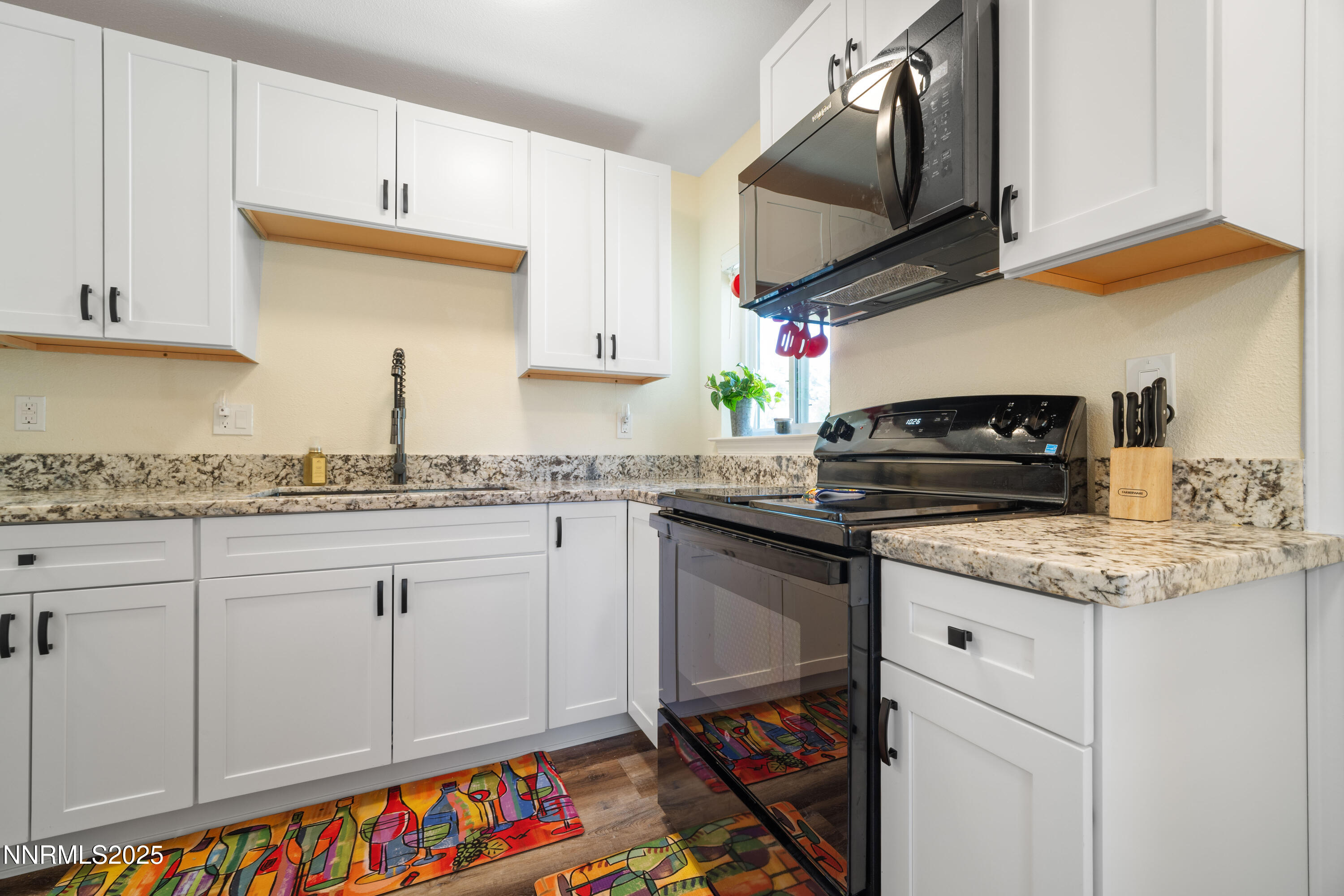 425 Main Street Silver City, NV 89428 - Photo 14 of 27 a kitchen with stainless steel appliances granite countertop a sink stove and cabinets
