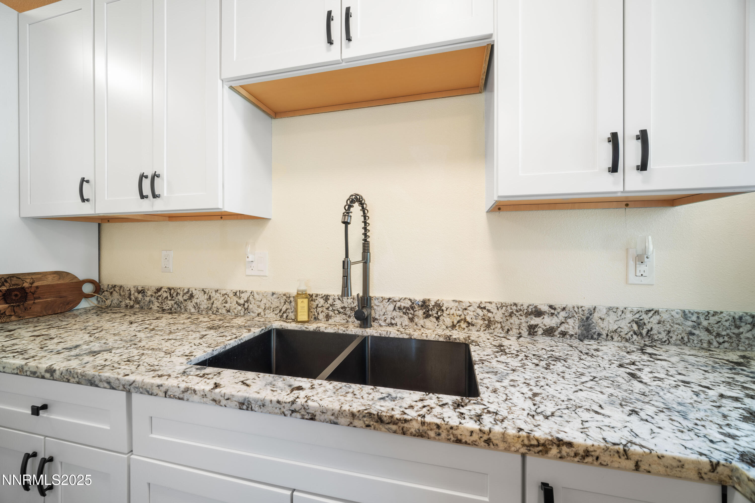 425 Main Street Silver City, NV 89428 - Photo 15 of 27 a kitchen with stainless steel appliances granite countertop a sink and a stove