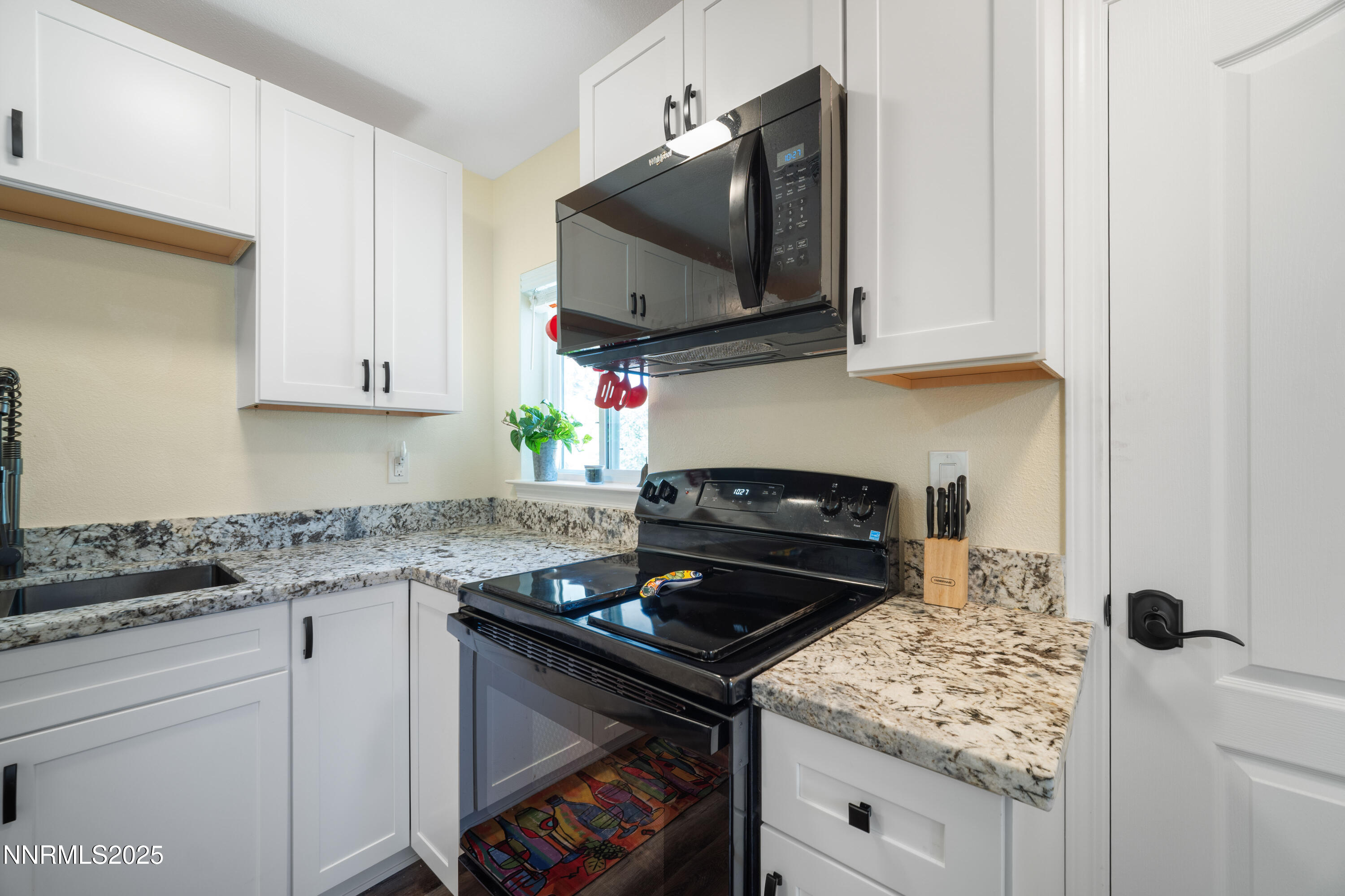 425 Main Street Silver City, NV 89428 - Photo 16 of 27 a kitchen with a stove and a microwave