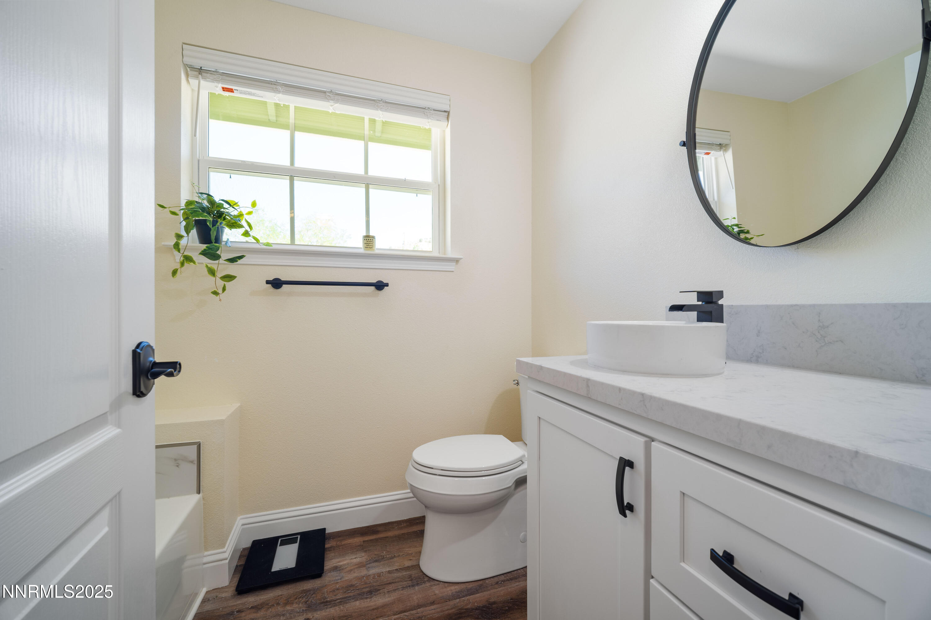425 Main Street Silver City, NV 89428 - Photo 18 of 27 a bathroom with a sink a toilet and a mirror