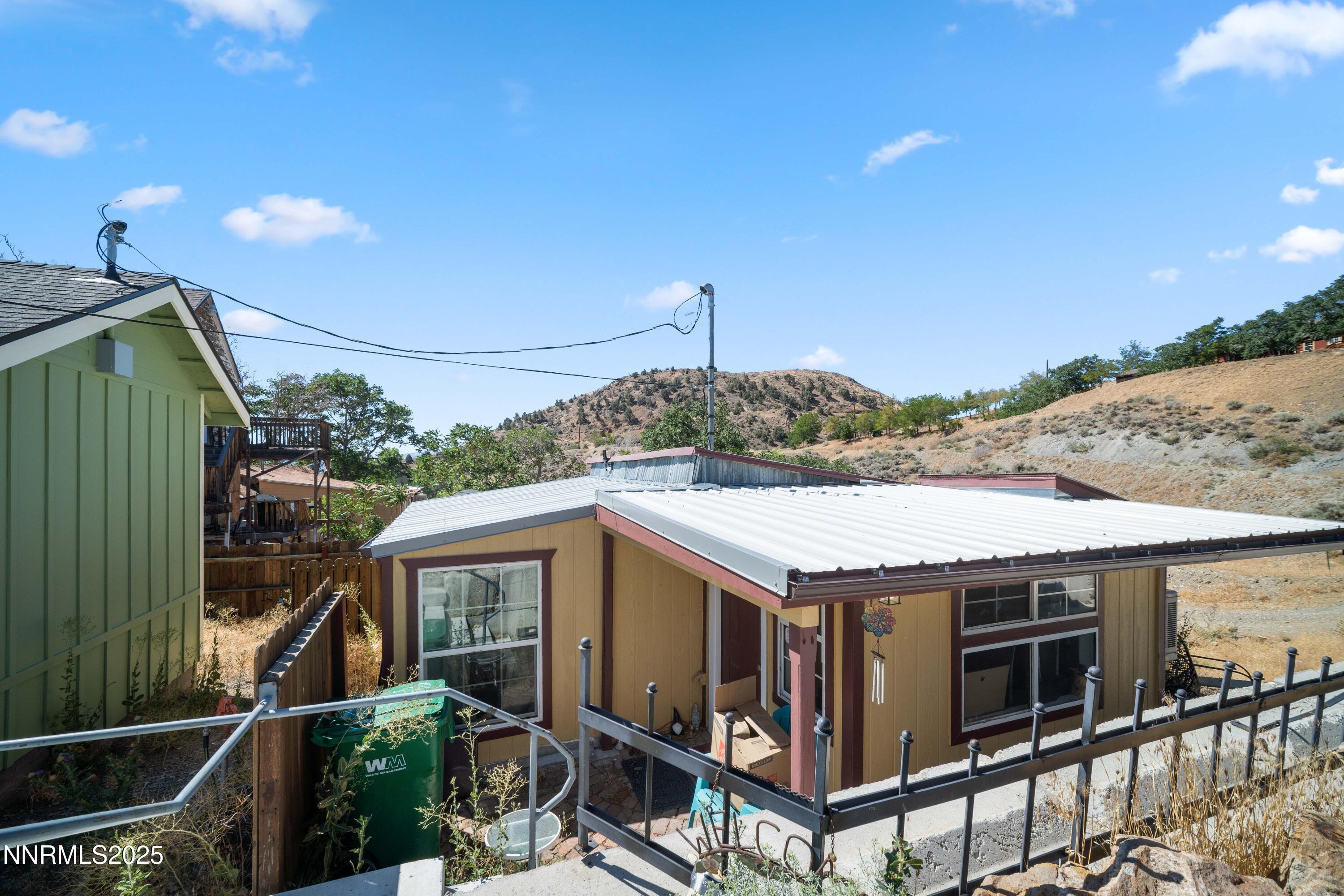 425 Main Street Silver City, NV 89428 - Photo 19 of 27 a roof deck with table and chairs a barbeque