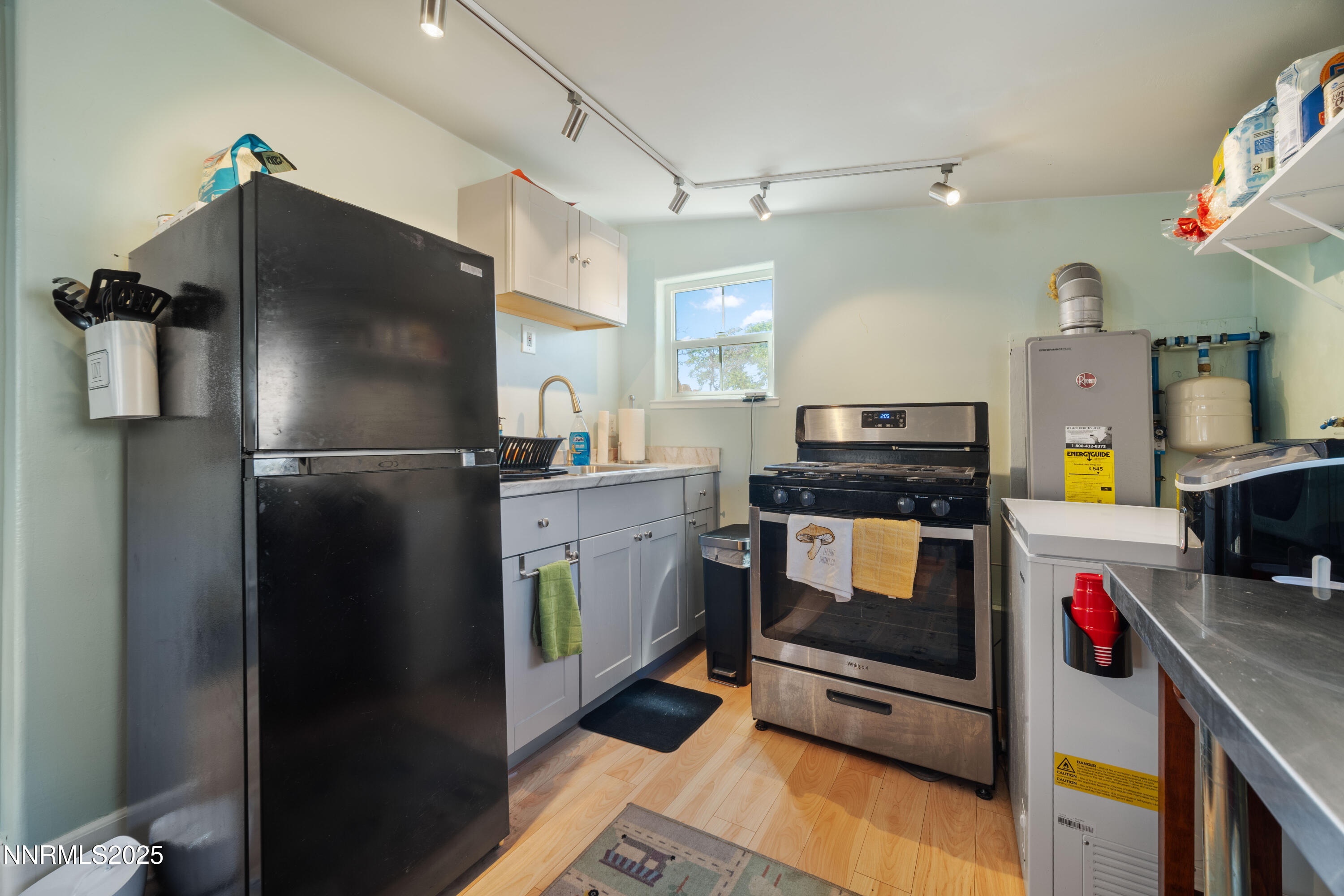 425 Main Street Silver City, NV 89428 - Photo 23 of 27 a kitchen with refrigerator and window