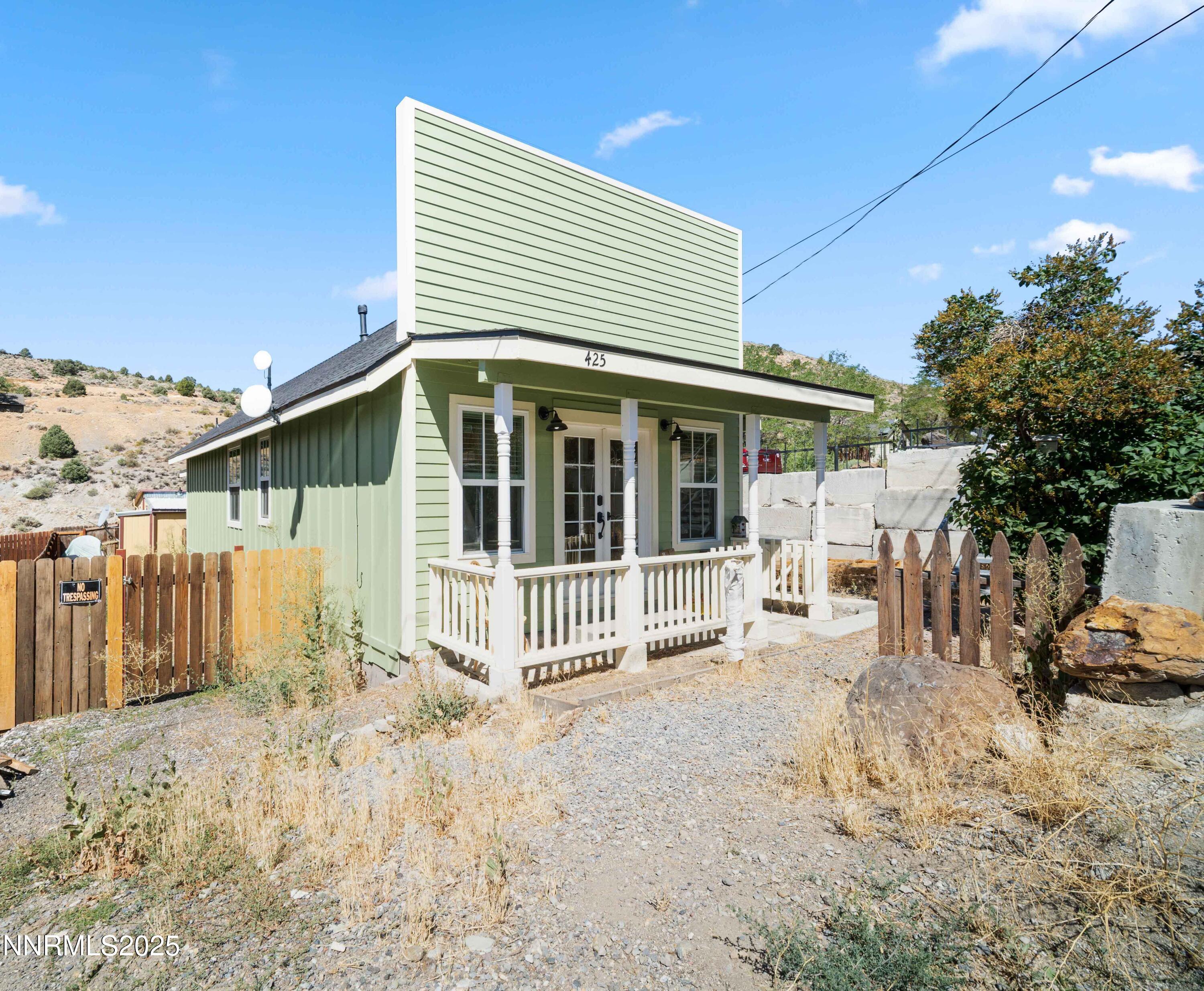 425 Main Street Silver City, NV 89428 - Photo 26 of 27 a view of a house with a large window and yard