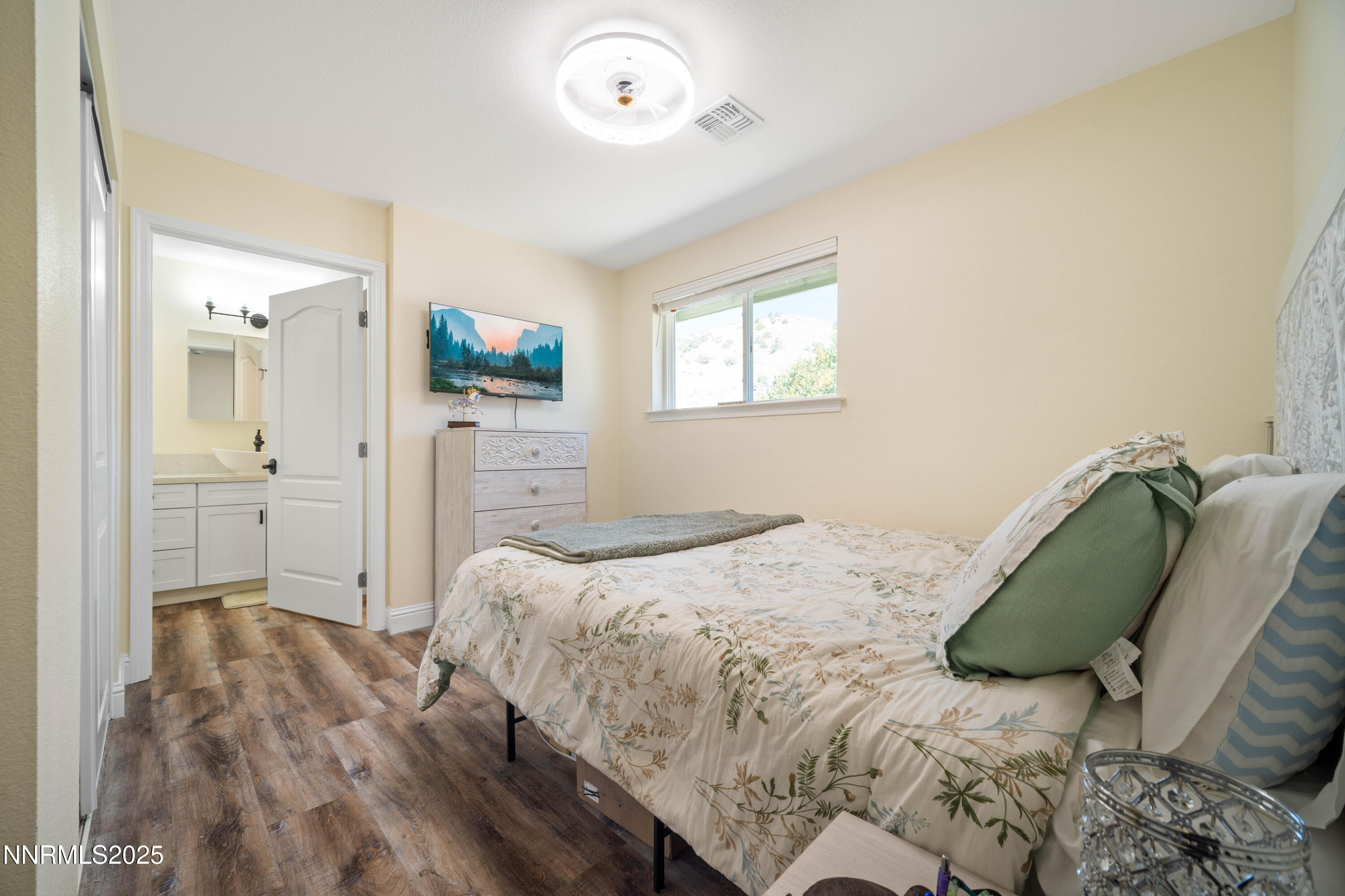 425 Main Street Silver City, NV 89428 - Photo 9 of 27 a bedroom with a bed and a flat screen tv