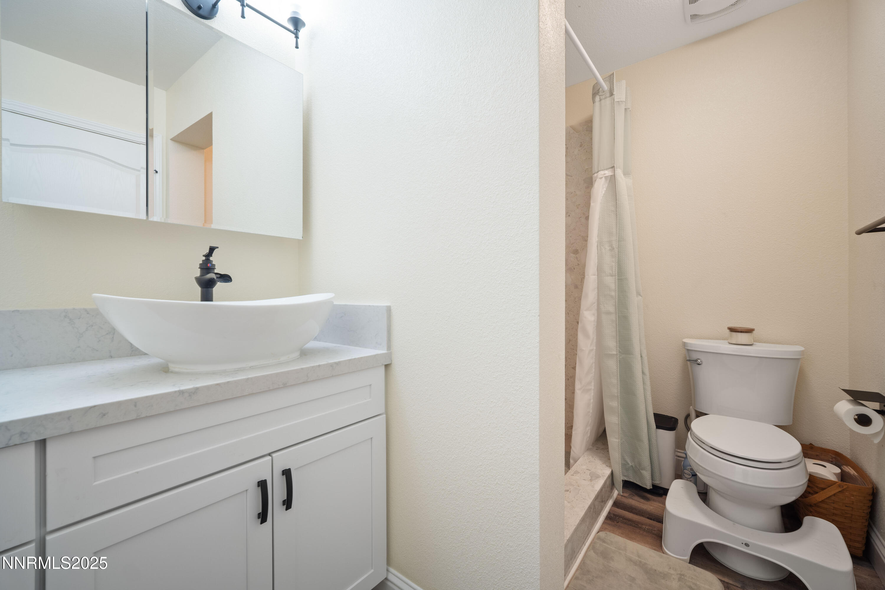 425 Main Street Silver City, NV 89428 - Photo 10 of 27 a bathroom with a sink a toilet and a mirror