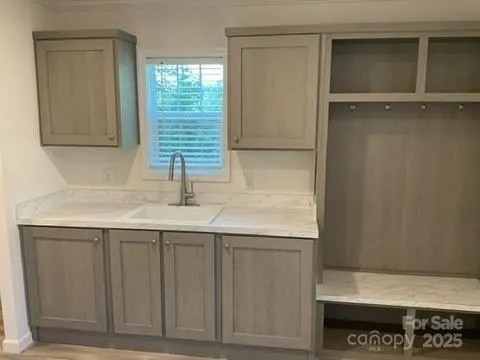 a kitchen with a sink and a window