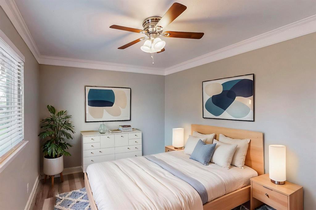 2240 Tarpley Road, Unit 464 Carrollton, TX 75006 - Photo 13 of 18 a bedroom with a bed and a potted plant