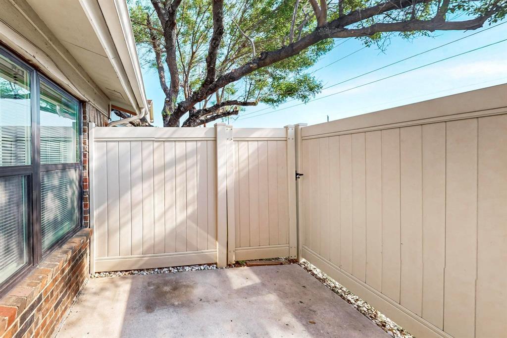 2240 Tarpley Road, Unit 464 Carrollton, TX 75006 - Photo 16 of 18 a view of an entrance with wooden wall