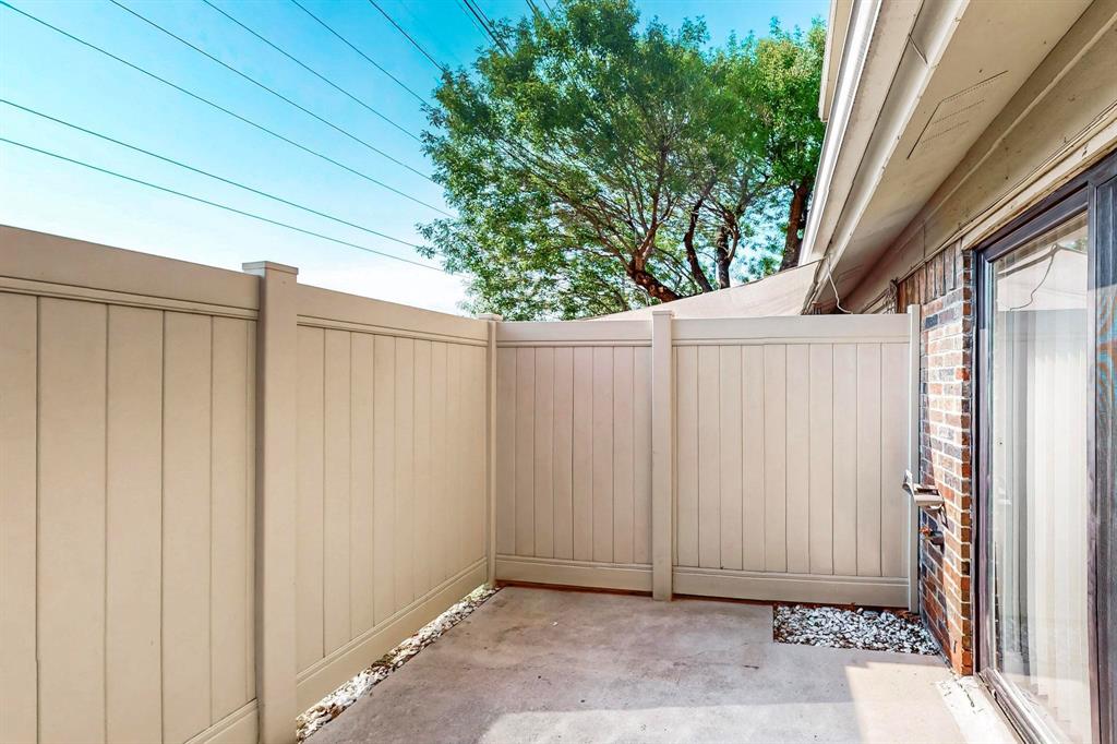 2240 Tarpley Road, Unit 464 Carrollton, TX 75006 - Photo 17 of 18 a view of a house with a backyard
