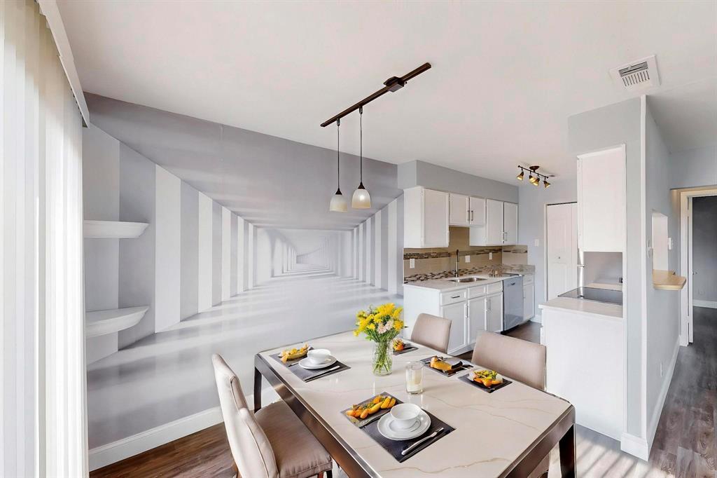 2240 Tarpley Road, Unit 464 Carrollton, TX 75006 - Photo 5 of 18 a kitchen with a refrigerator a stove a sink dishwasher and white cabinets with wooden floor