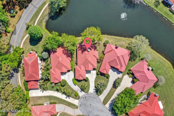 an aerial view of swimming pool outdoor seating and yard