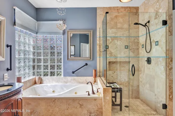 a bathroom with a bathtub and shower