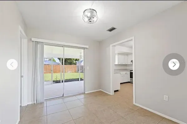 a view of an empty room and a windows