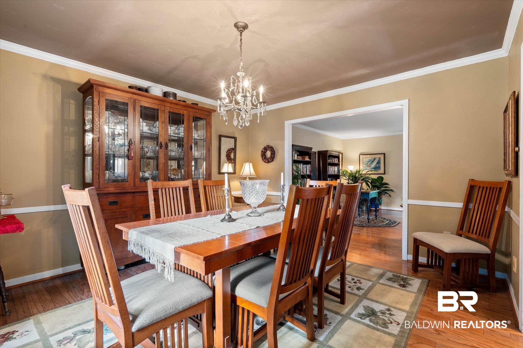 559 East Cumberland Road Mobile, AL 36608 - Photo 6 of 48 Dining area featuring light wood finished floors, suspended lighting, and ornamental molding