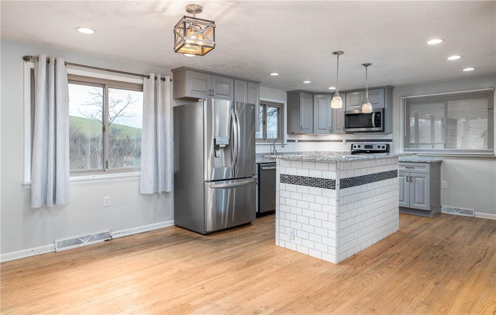 137 Hornhead Road McDonald, PA 15057 - Photo 7 of 27 WALL REMOVED BETWEEN KITCHEN AND DINING AREA.