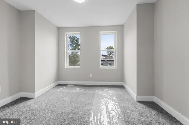 an empty room with windows