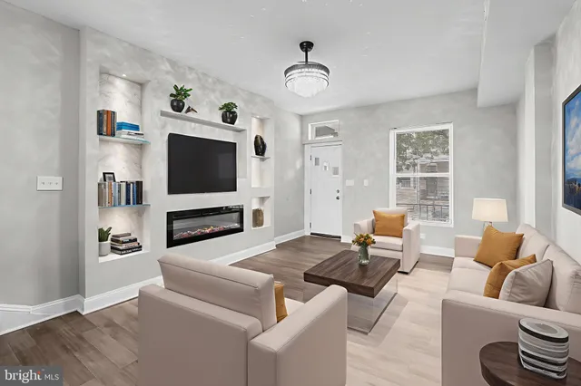 a living room with fireplace furniture and a flat screen tv