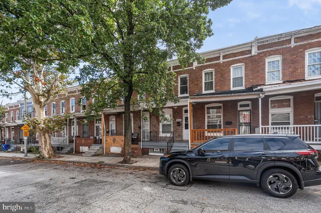 a car parked in front of a house