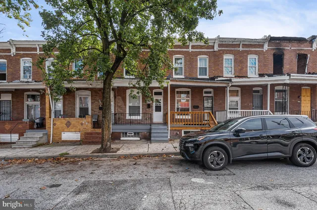 a car parked in front of a house