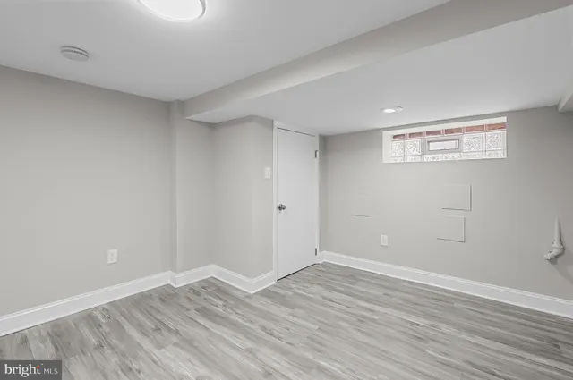 a view of room with wooden floor