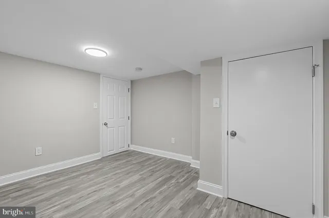 a view of room with wooden floor