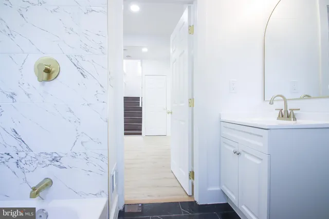 a bathroom with a sink and a shower