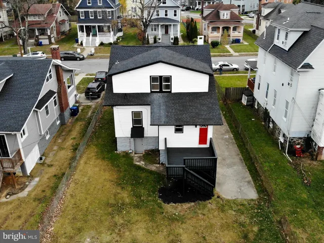 a aerial view of a house with a yard
