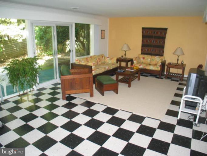 6310 Redwing Road Bethesda, MD 20817 - Photo 3 of 10 Family Room with Fireplace - Backing to trees