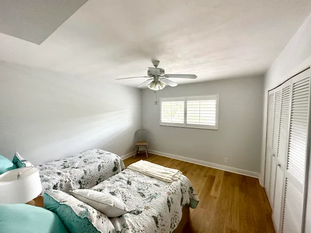 a bedroom with bed and window