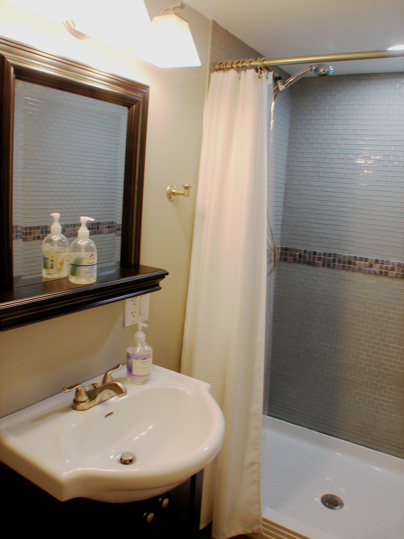 22 Manor Road Lake Zurich, IL 60047 - Photo 29 of 40 a bathroom with a sink and a mirror