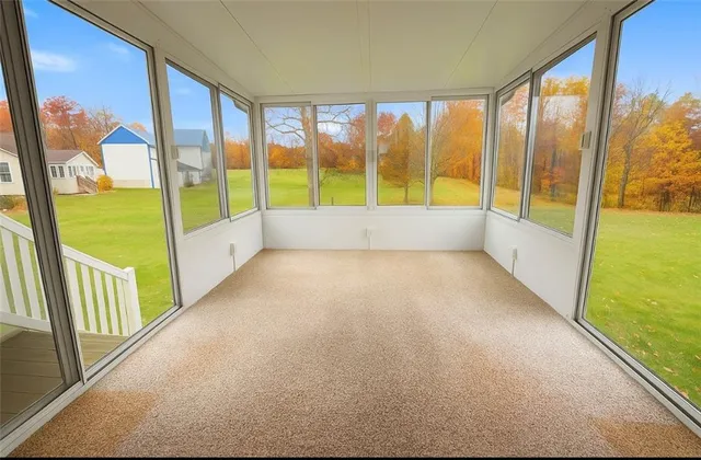 a view of an empty room with a large window