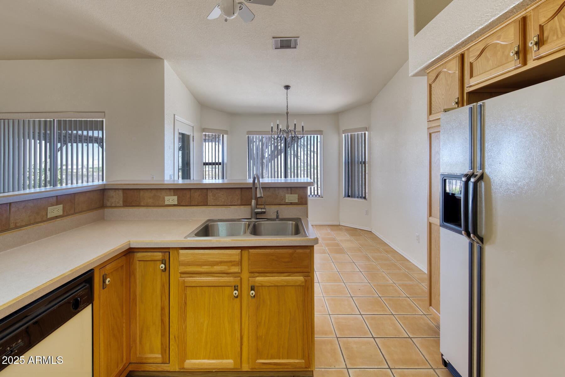 2290 North Ranch Trail Huachuca City, AZ 85616 - Photo 12 of 28 a kitchen with a sink appliances and cabinets