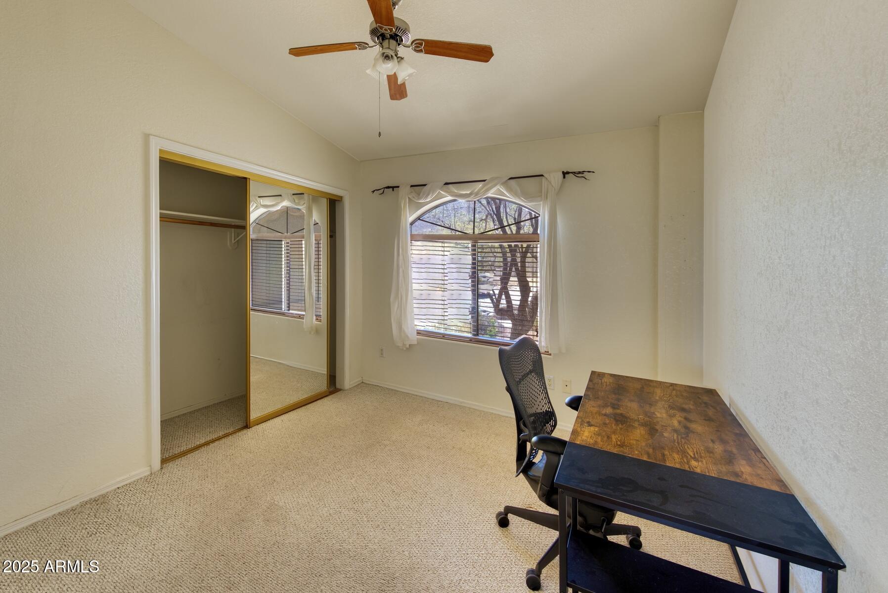 2290 North Ranch Trail Huachuca City, AZ 85616 - Photo 13 of 28 a view of a workspace with furniture and a window