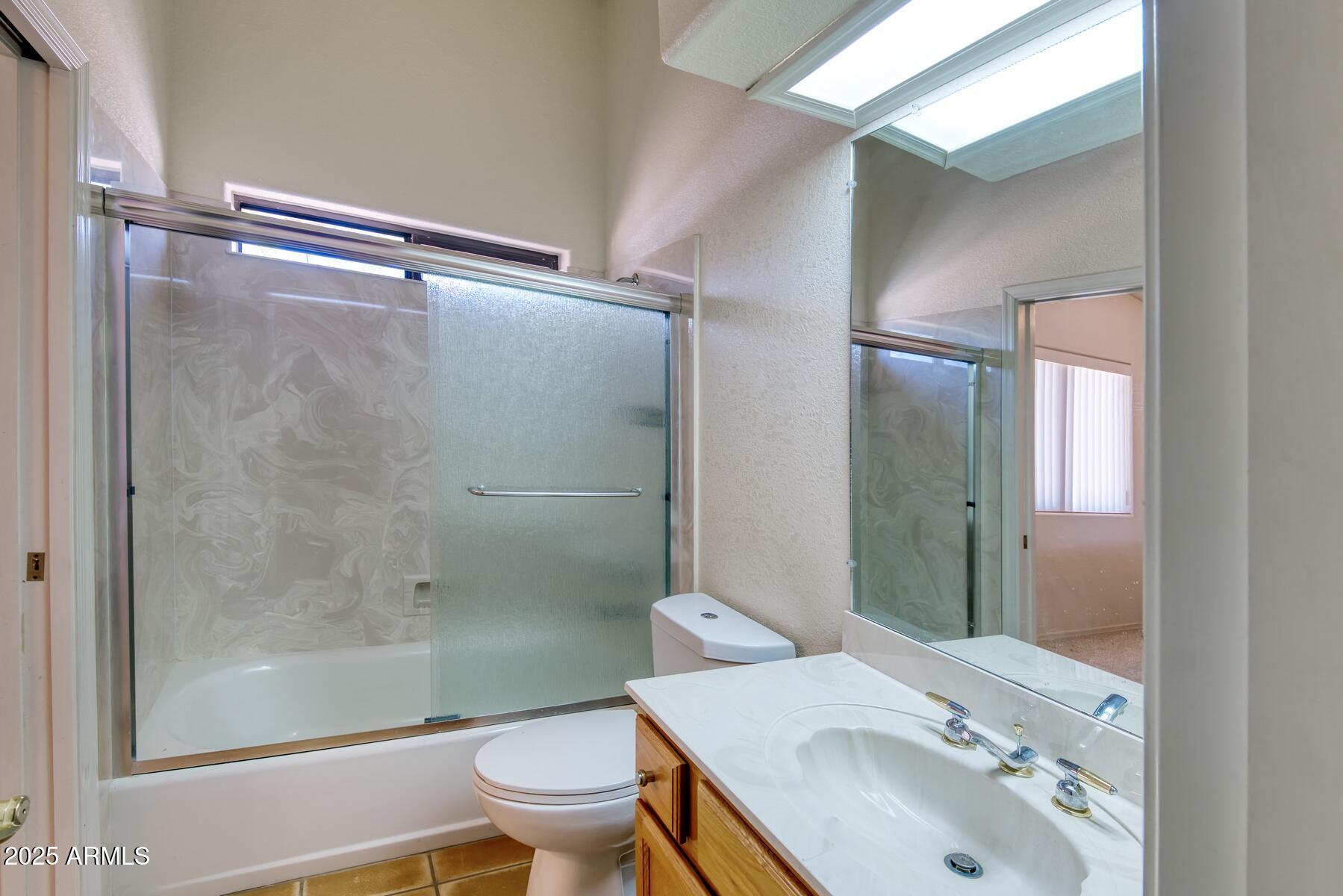 2290 North Ranch Trail Huachuca City, AZ 85616 - Photo 16 of 28 a bathroom with a sink toilet and shower