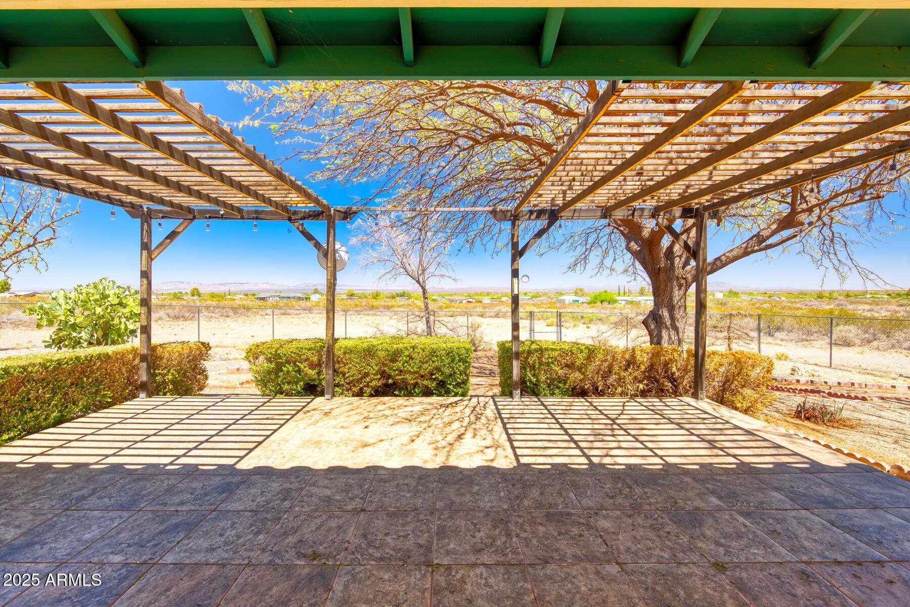 2290 North Ranch Trail Huachuca City, AZ 85616 - Photo 25 of 28 a view of a swimming pool with an outdoor space