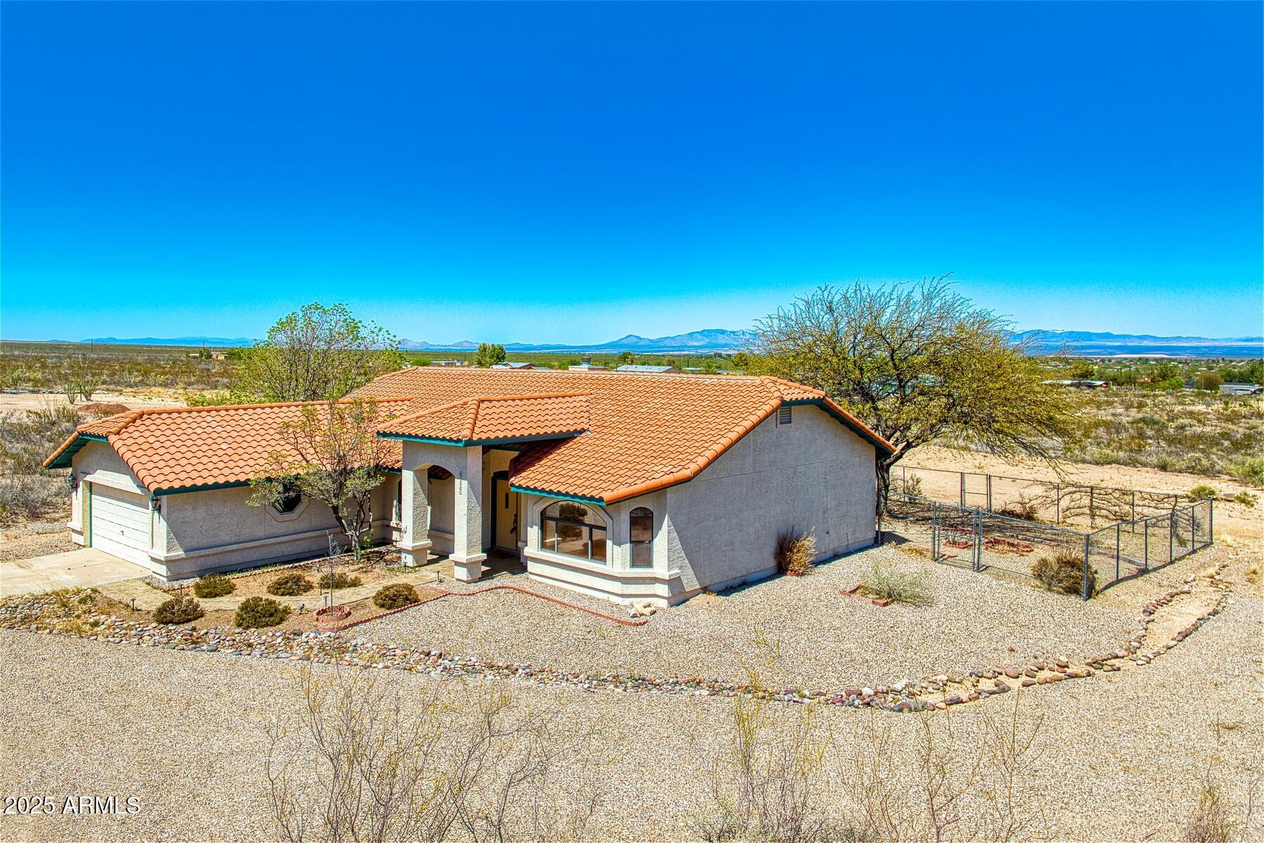 2290 North Ranch Trail Huachuca City, AZ 85616 - Photo 4 of 28 a house with a outdoor space